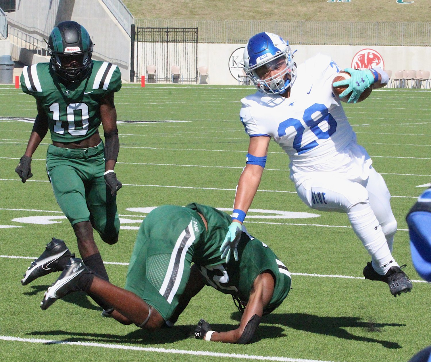 Taylor junior running back Tyler Irving carries the ball during Saturday's game against Mayde Creek at Legacy Stadium.